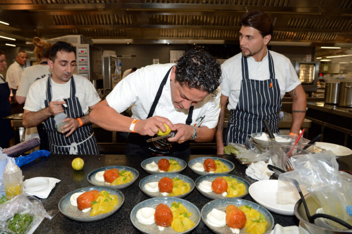 Chefs preparing plates at Who's Cooking Dinner?