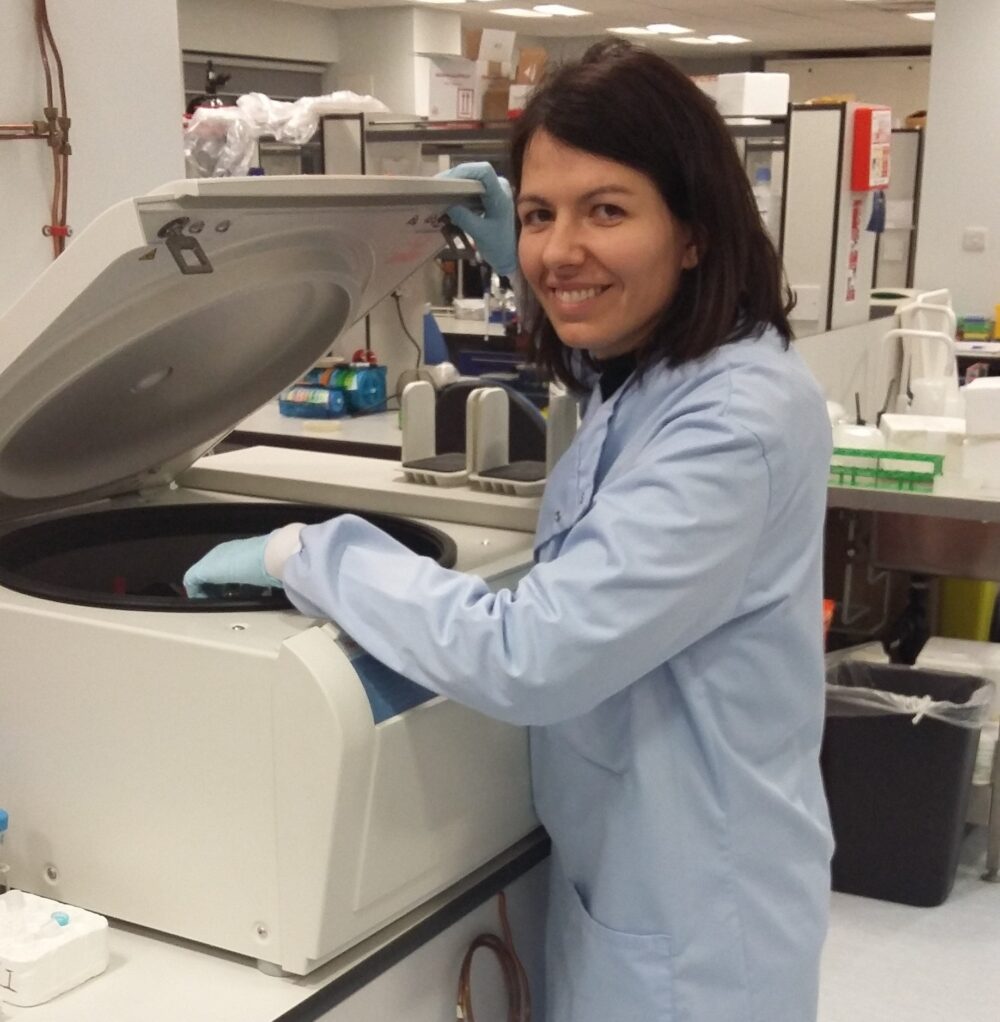 Researcher Dr Samanta operating a centrifuge in a laboratory