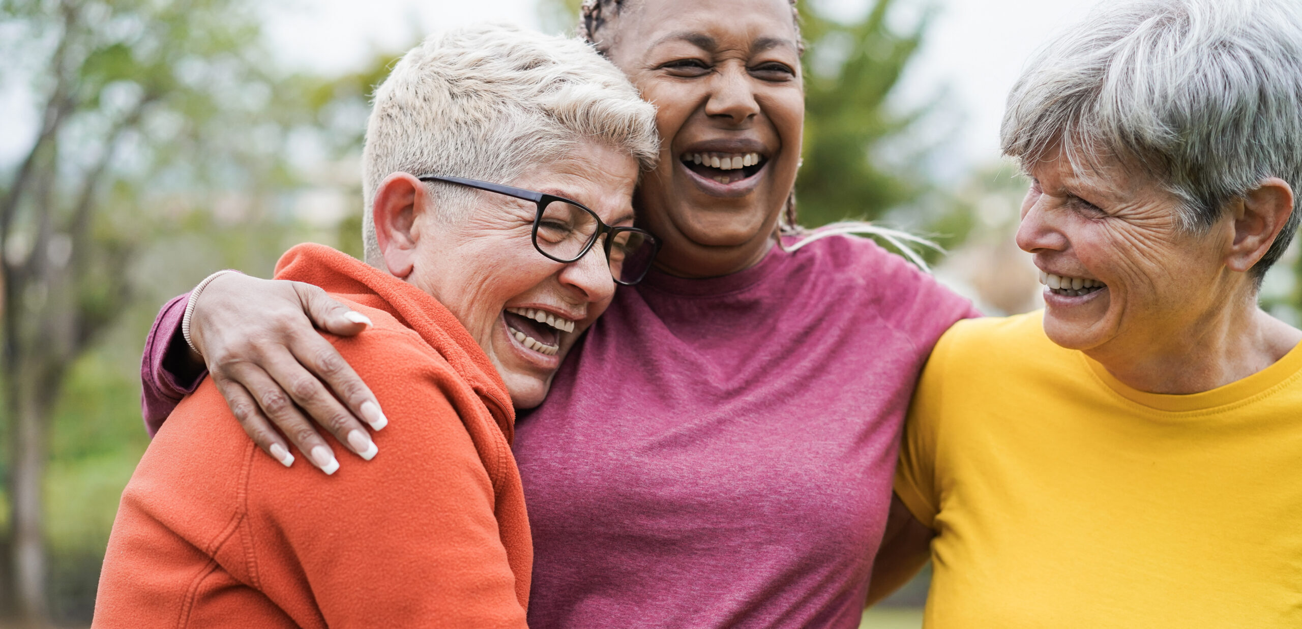 Multiracial senior women having fun together after sport workout outdoor - Main focus on right female face