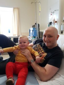 Andrew in hospital with daughter Abigail