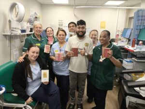 Mooni with the nurses who looked after him at Stoke Hospital