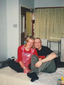 Jody sat on a bed with Tasha